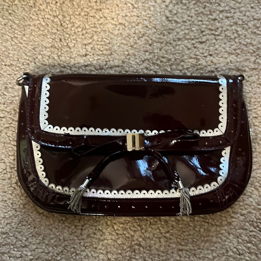 Karen Millen small clutch burgundy patent leather silver accents.